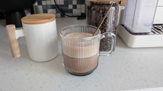 Coffee mugs and bean canister on countertop