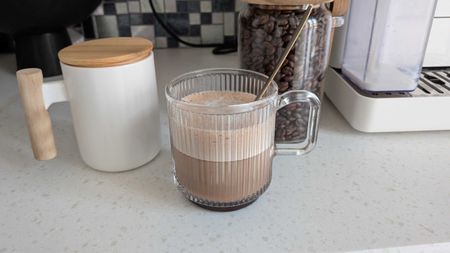 Coffee mugs and bean canister on countertop