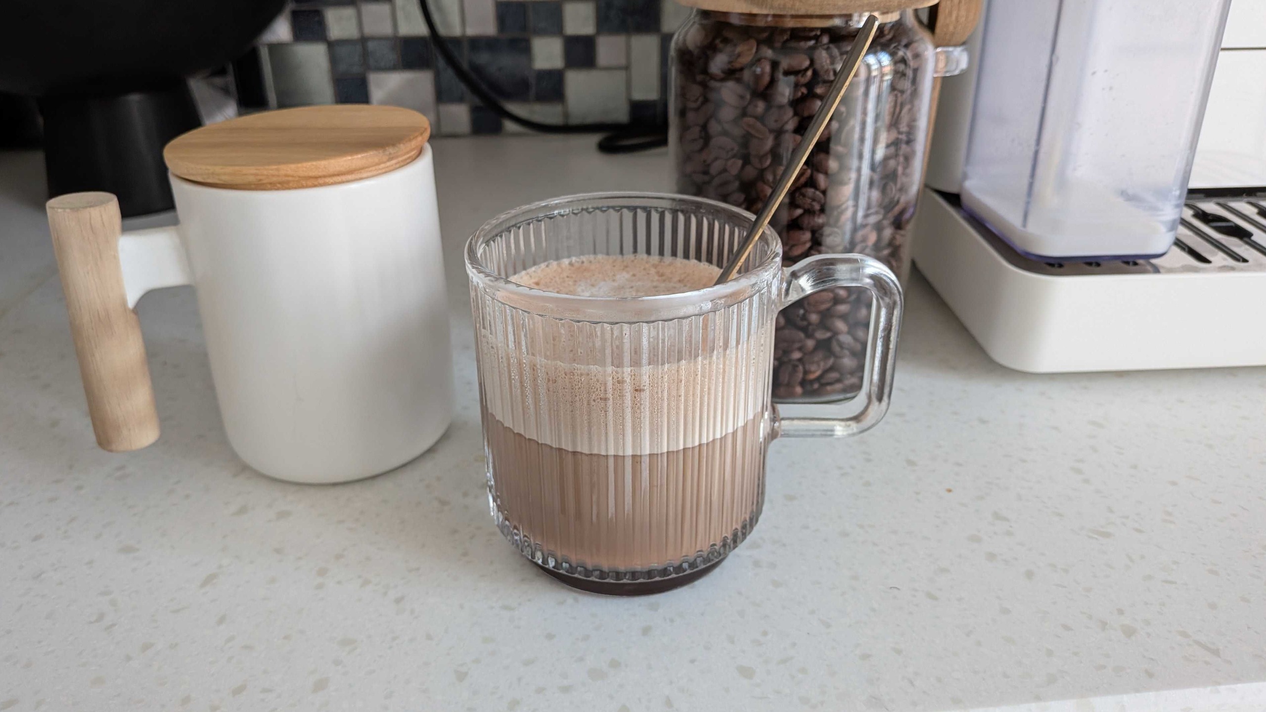 Coffee mugs and bean canister on countertop