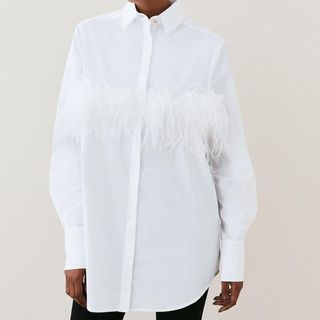 white shirt with feathers