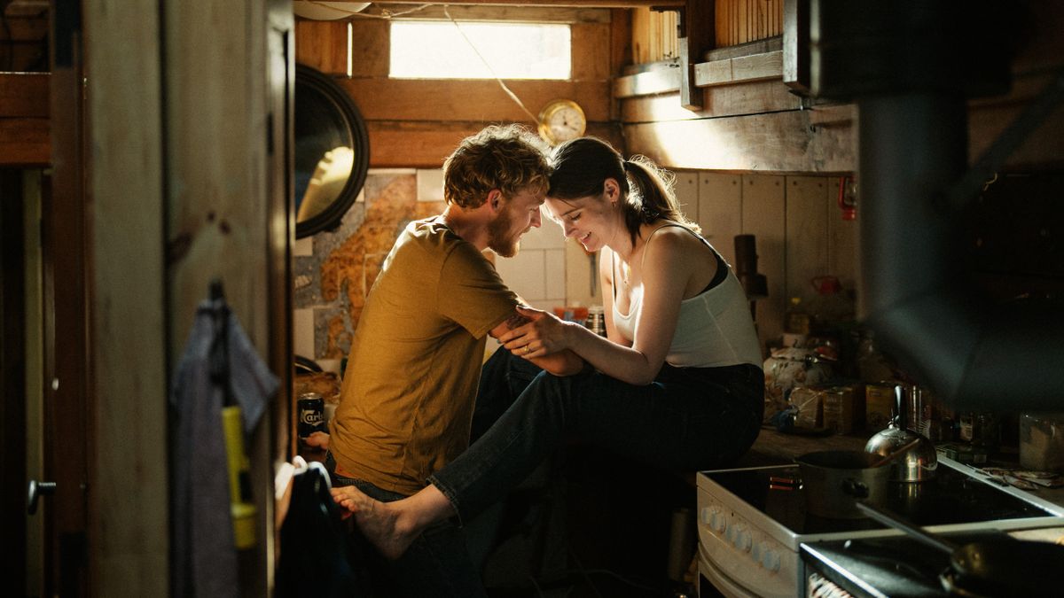 Elliott (Christopher) and Lilly (Inga Ibsdotter Lilleaas) together in a kitchen in A Beautiful Life