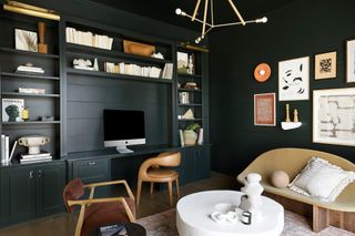 a dark home office painted all black
