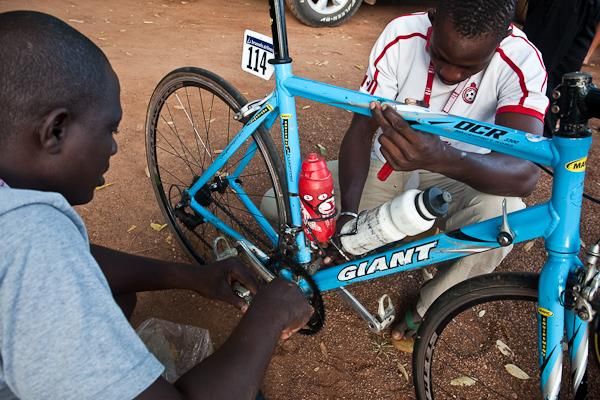 Bruno the mechanic (left) works on one of the team bikes.