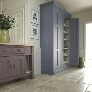 limestone flooring with cupboard and cabinet