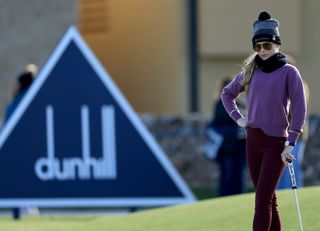 Kathryn Newton in front of the Dunhill logo