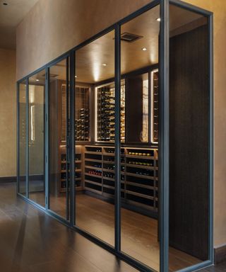 Black framed glass doors, wine cooler room