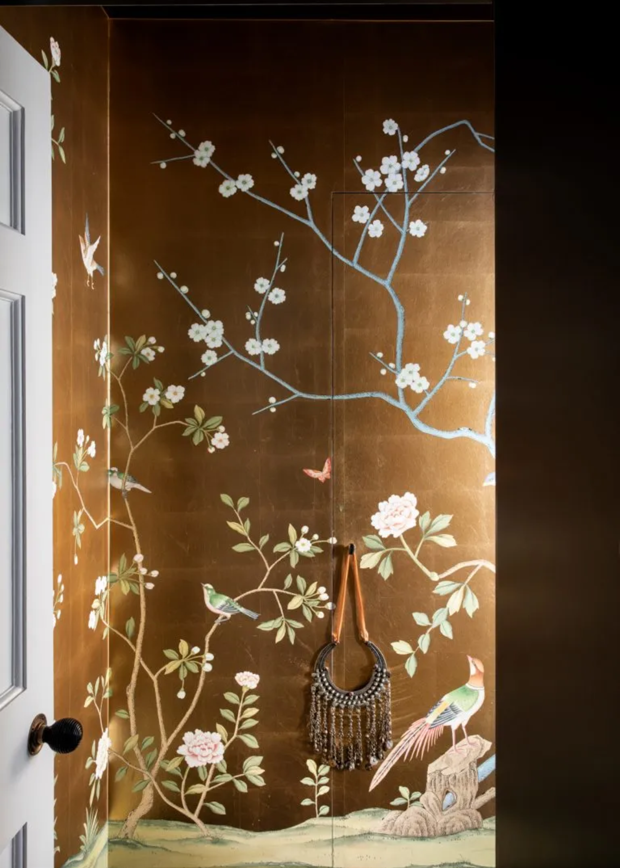 A wardrobe with a floral mural