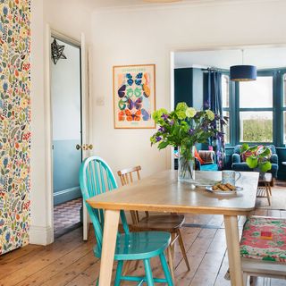 dining room with wooden table and painted chairs