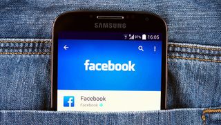 The Facebook app as seen on a smartphone in somebody's pocket 