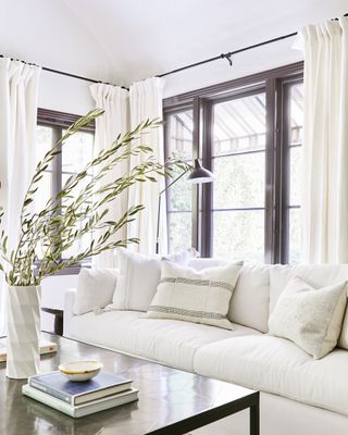 a white couch in a white living room