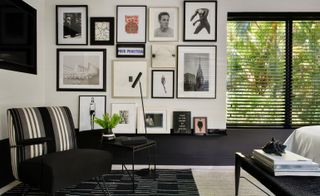 Photo frames on the wall in a bedroom corner