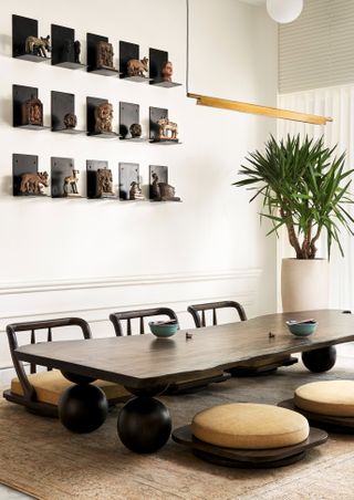 A small dining room with low seating