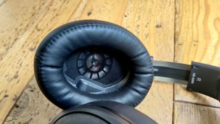 Sennheiser HD 620S headphones showing inner ear on a wooden floor