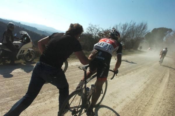 Fabian Cancellara (RadioShack-Nissan) has help after a puncture