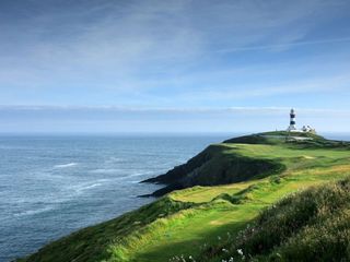 The stunning 4th hole at Old Head pictured with the lighthouse beyond