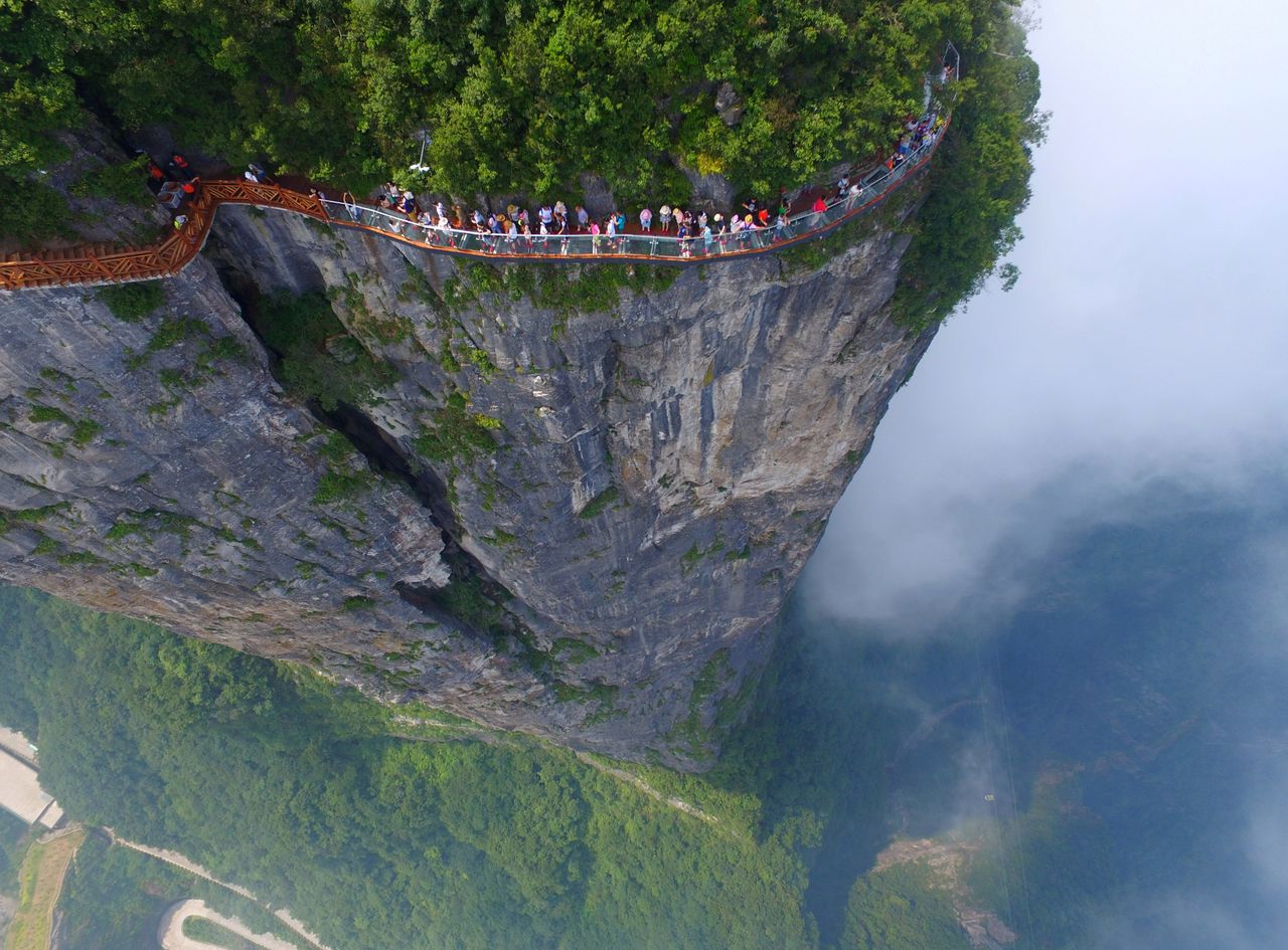 People walk on a sightseeing platform in Zhangjiajie, Hunan Province, China.