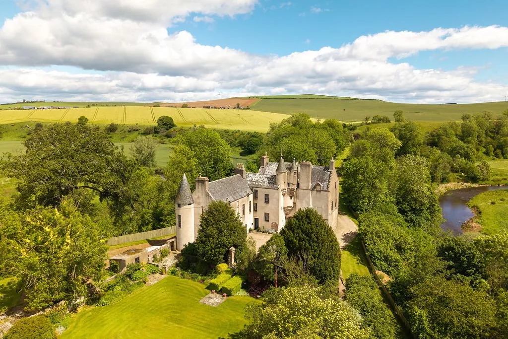 A view of Allardice Castle from above, with the river on the right