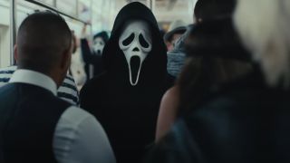 Ghostface stalks a kill on the subway in Scream VI.
