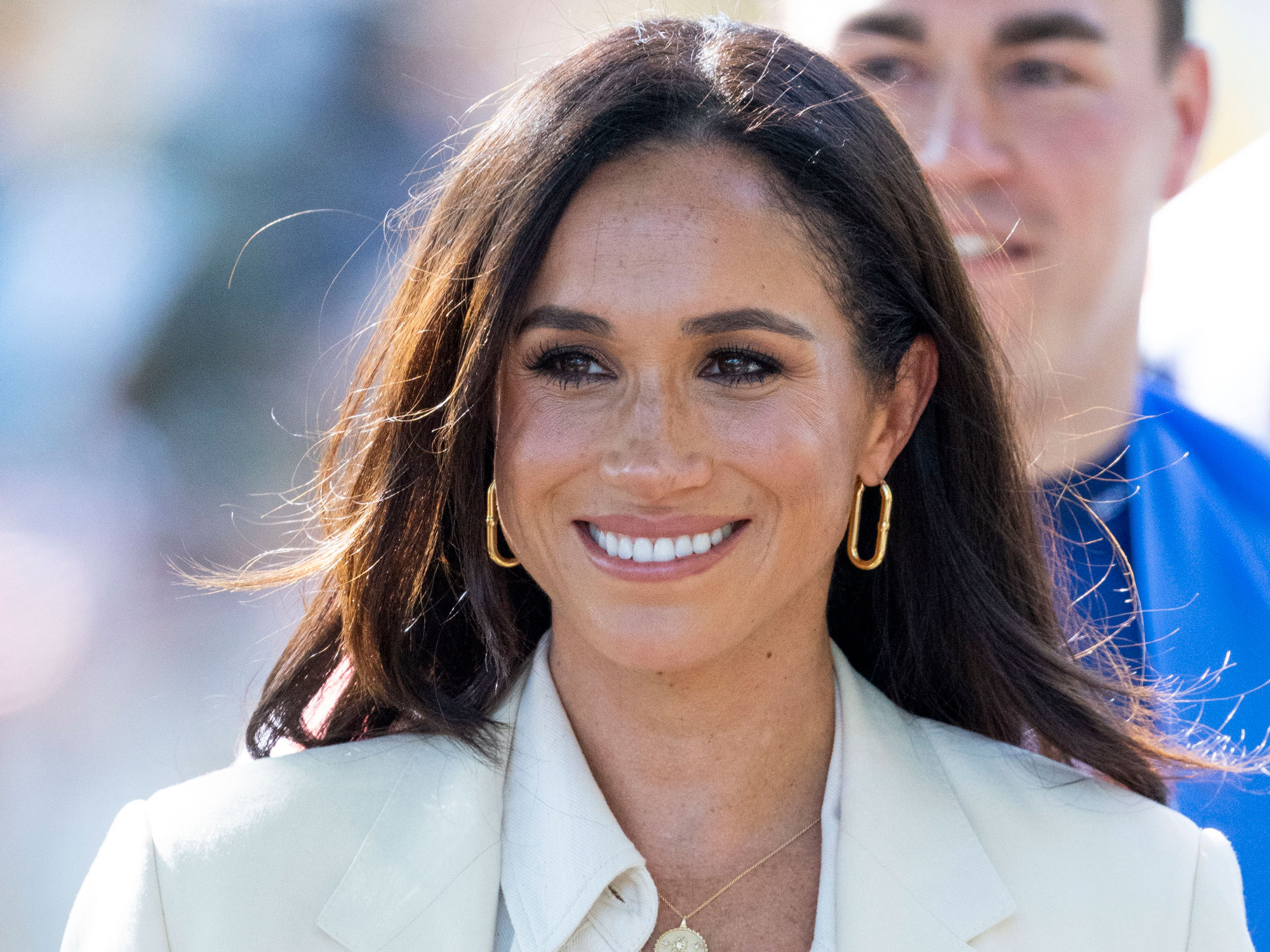 Meghan Markle takes off the camera and smiles