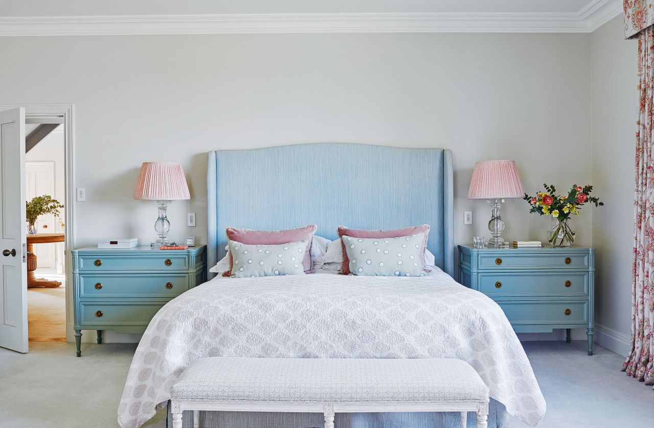 Bedroom with blue headboard