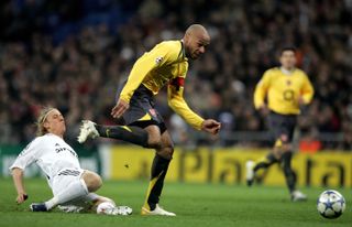 Thierry Henry shakes off a challenge from Guti on his way to scoring for Arsenal against Real Madrid at the Santiago Bernabeu in the Champions League in February 2006.