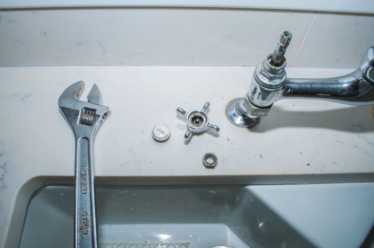 A kitchen tap that has been taken apart