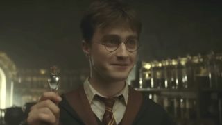Harry (Daniel Radcliffe) holds liquid luck in Harry Potter and the Half-Blood Prince.