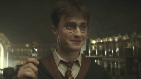 Harry (Daniel Radcliffe) holds liquid luck in Harry Potter and the Half-Blood Prince.