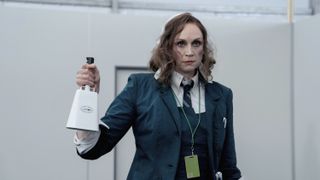 Gwendoline Christie holding a bell in Severance season 2.