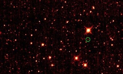 An asteroid (circled in green) 