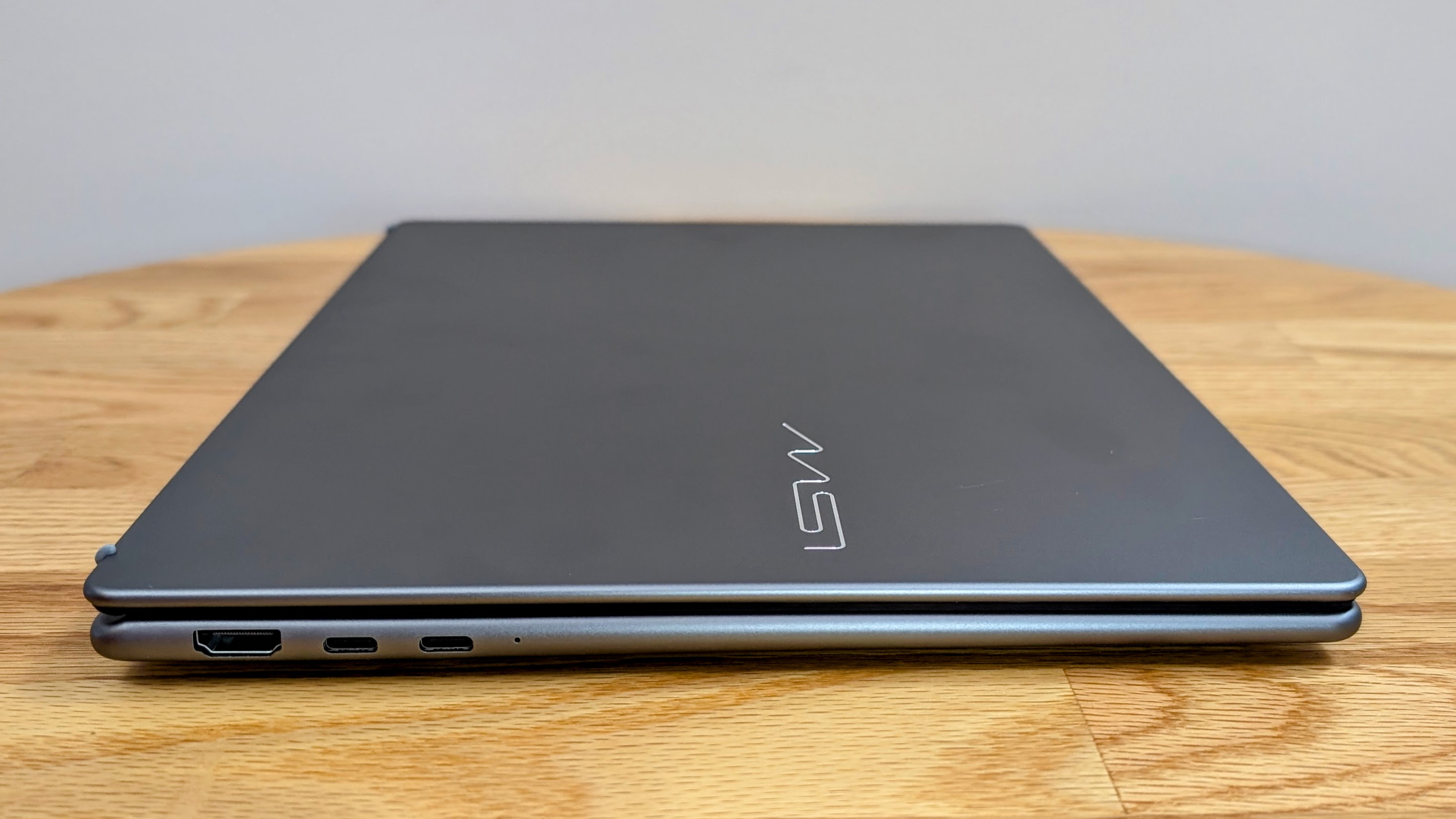 MSI Prestige 14 AI+ closed on a coffee table