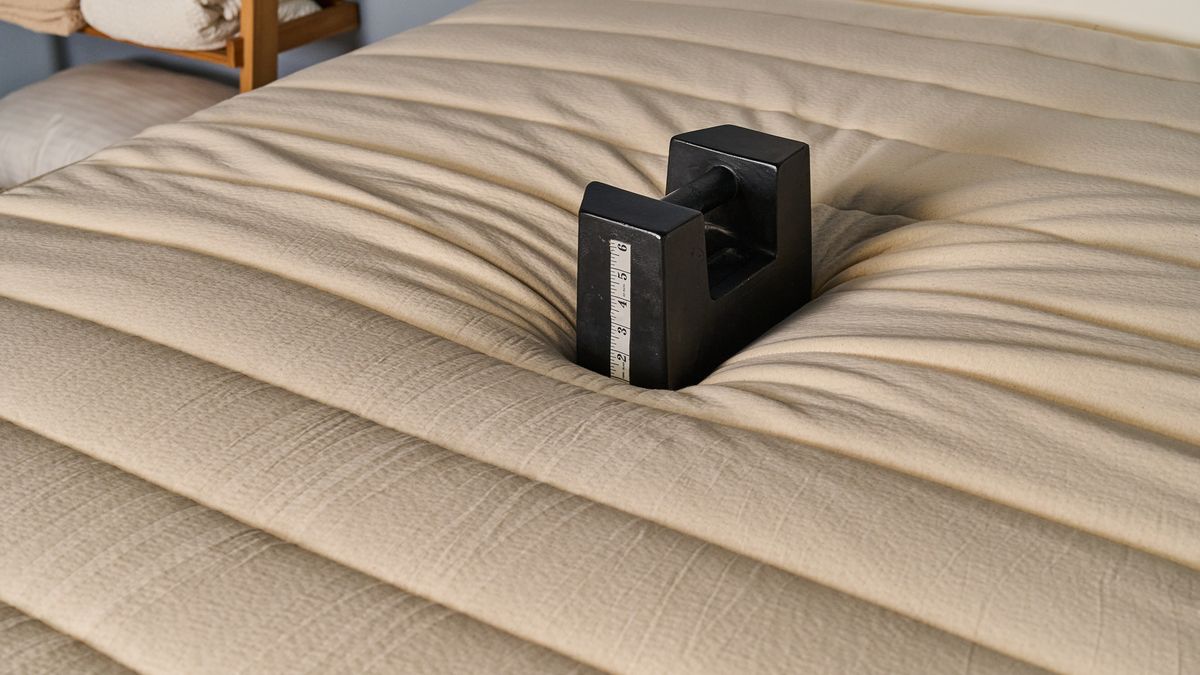 A heavy weight placed in the middle of the Birch Luxe Natural mattress sinking