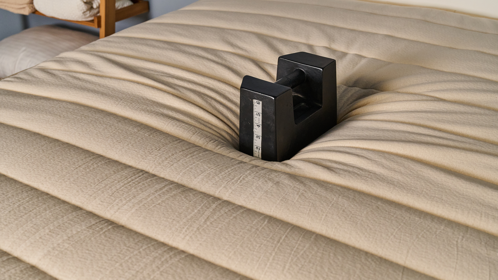 A heavy weight placed in the middle of the Birch Luxe Natural mattress sinking