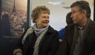 Philomena Dame Judi Dench sits excitedly with Steve Coogan