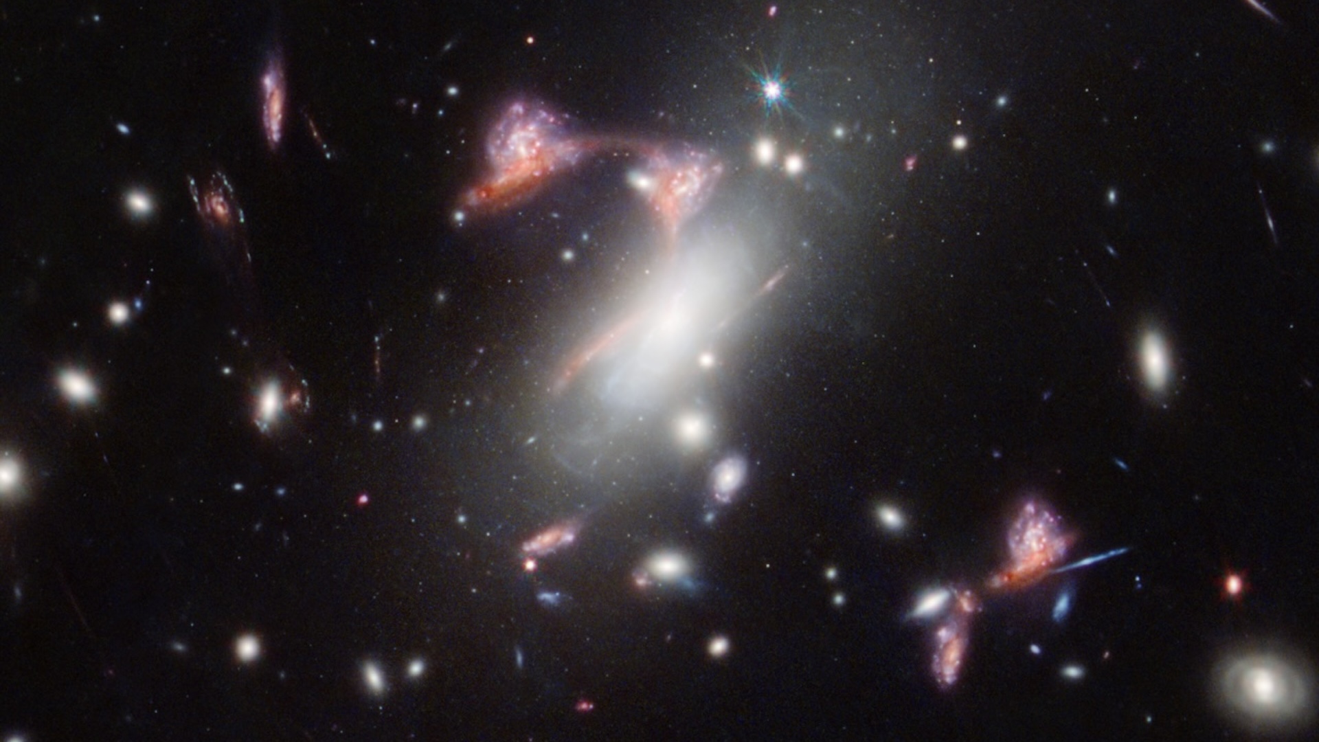 Science and Nature news A telescope image showing many distant galaxies, with some forming a question mark-like shape in the middle