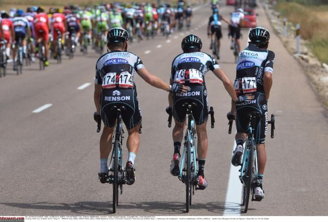 Rigoberto Uran gets a helping hand from his teammates at the Vuelta