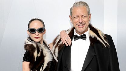Jeff Goldblum and emilie livingston on a white background