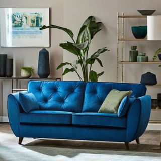 Blue sofa in beige living room