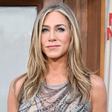 Jennifer Aniston attends premiere of Netflix's "Murder Mystery 2" wearing a silver naked dress