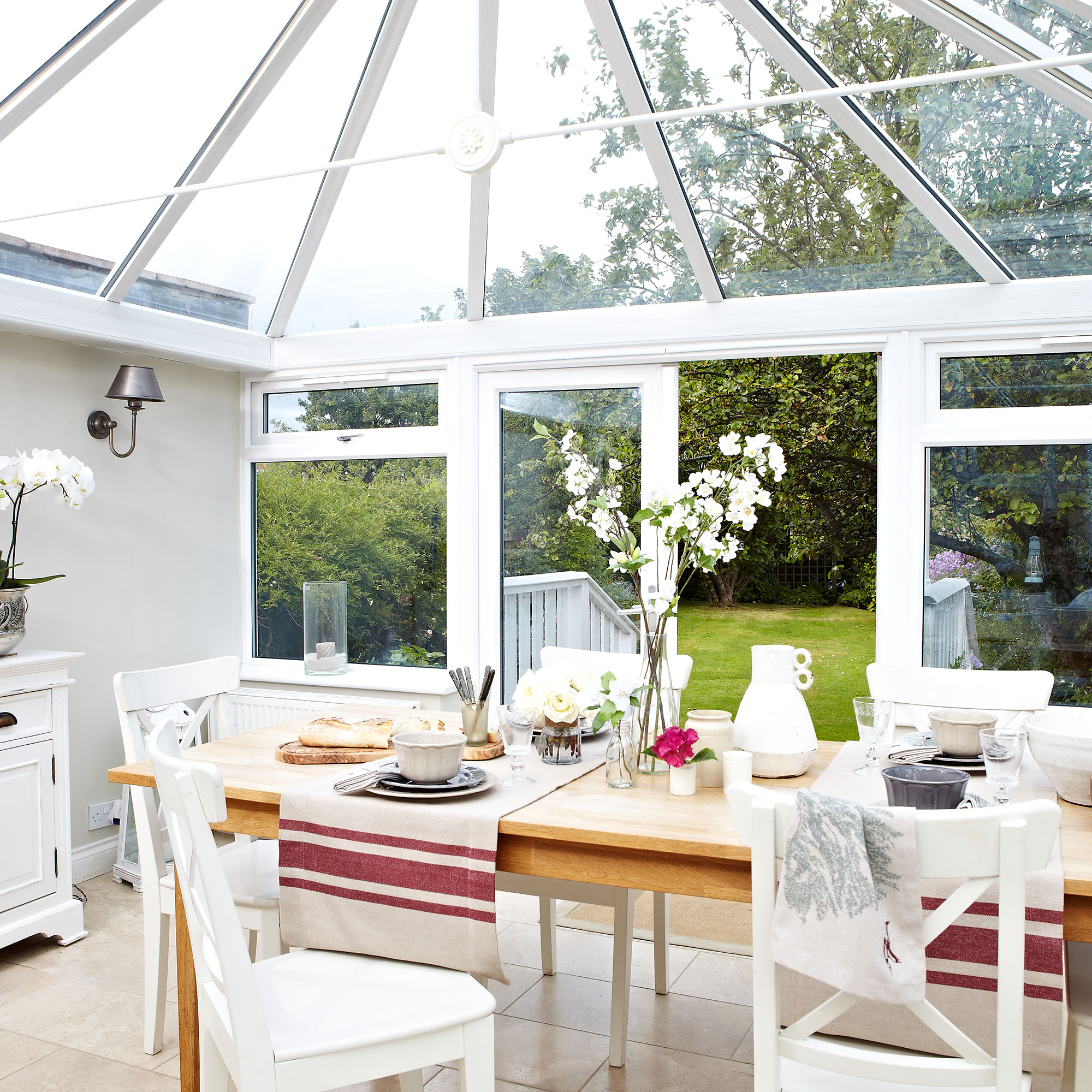 conservatory with white coloured and dining table