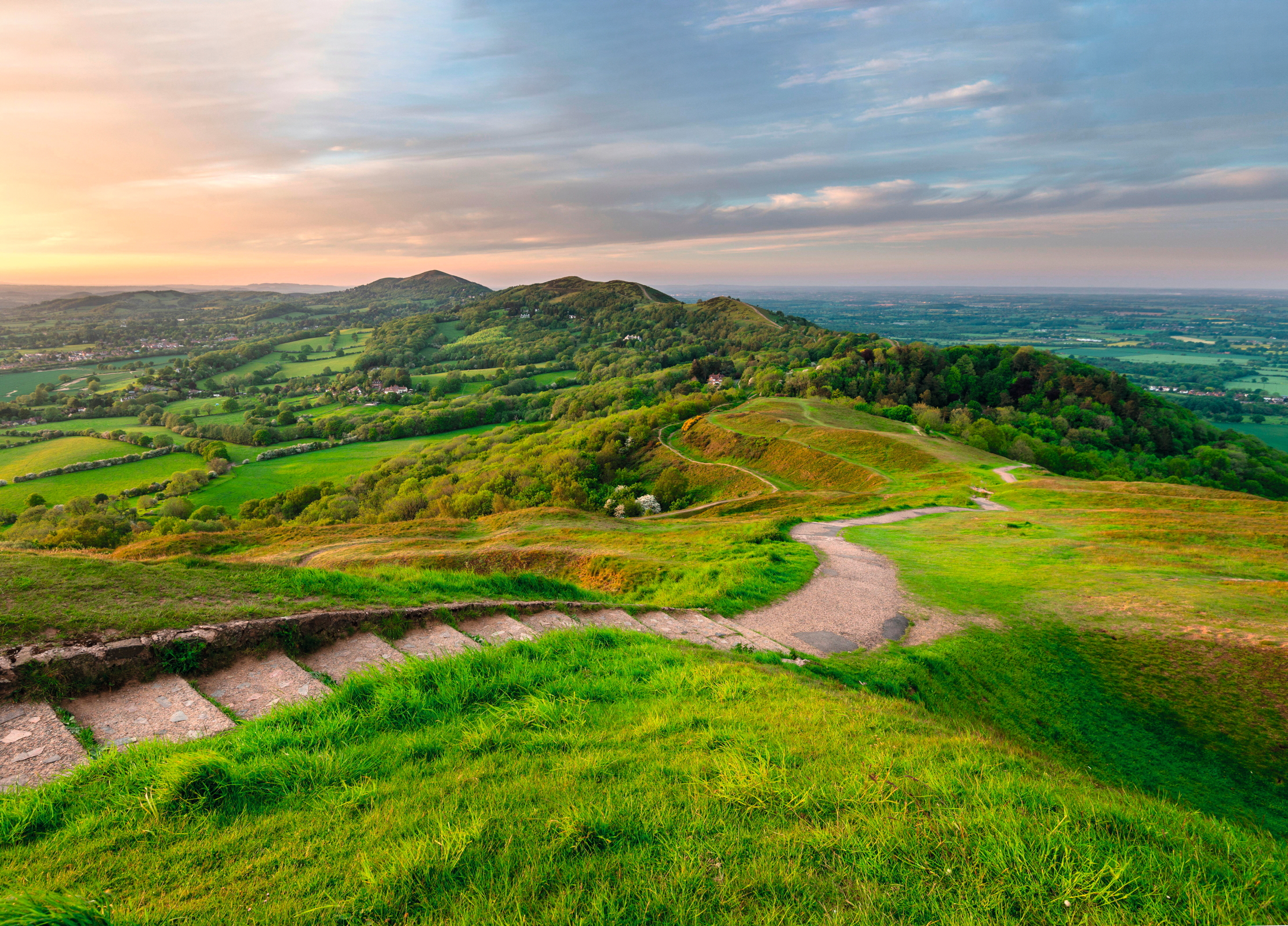 The Malvern Hills. The name Malvern comes from the Celtic words for bare hill (moel bryn) and Tolkien took many walks across these hills with his friend George Sayer. The Malverns are widely recognised as a point of inspiration for the White Mountains of Gondor.