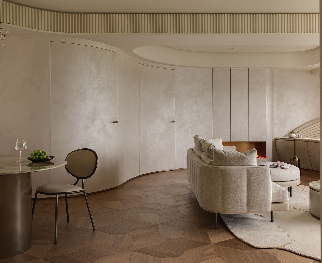 neutral living room with curved walls and wood flooring