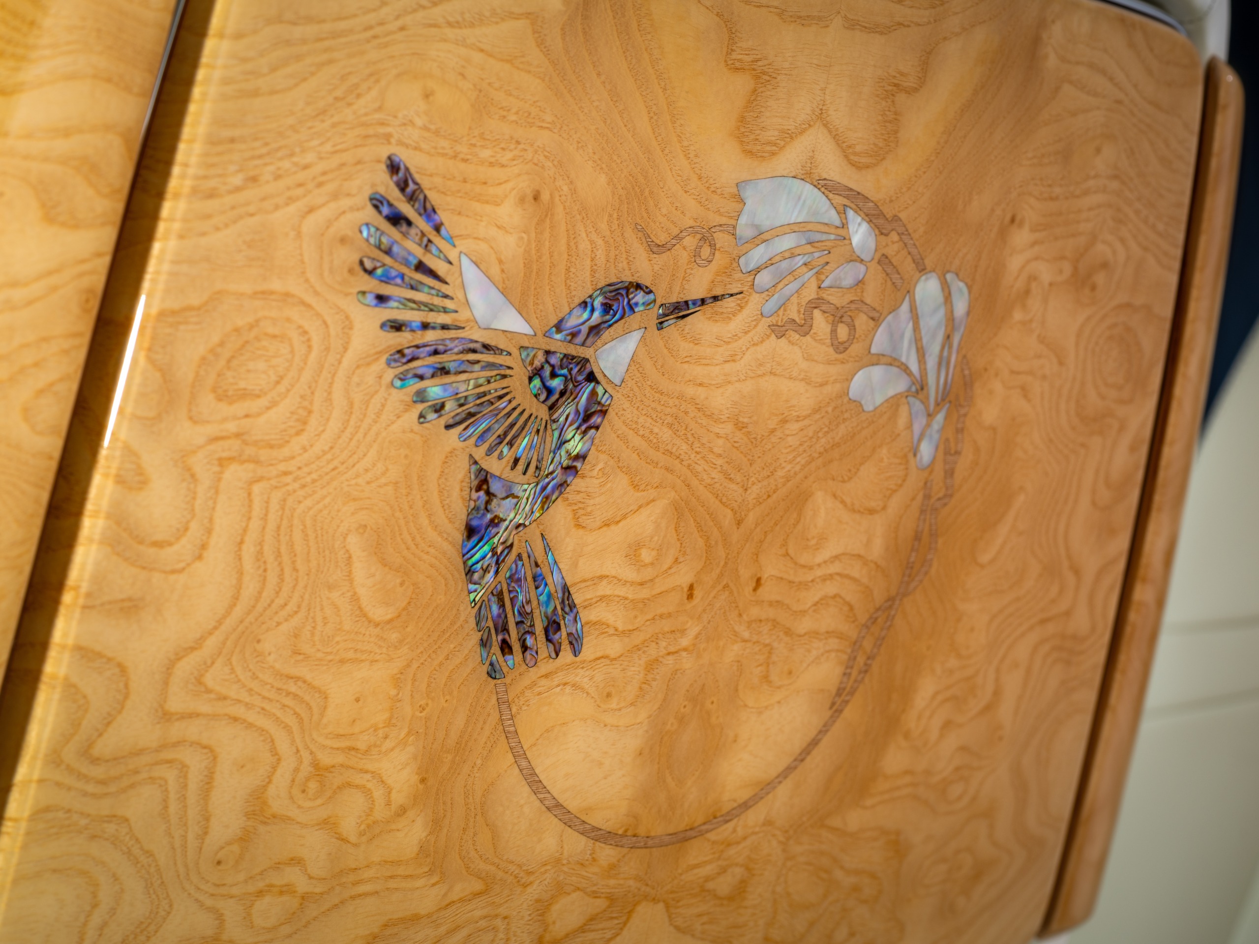 The hummingbird inlaid in the rear picnic table