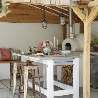 Outdoor kitchen with island and bench