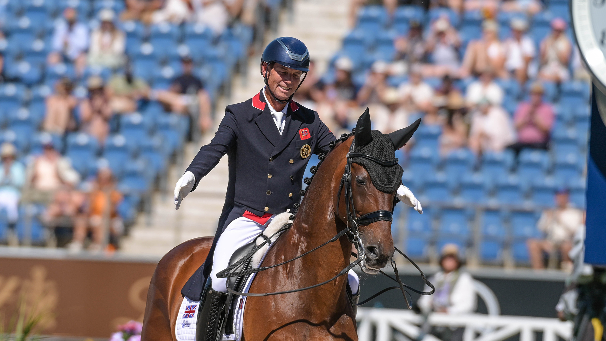 Carl Hester drops his reins as he praises his horse Fame after riding a test at the 2026 World Dressage Championships in Aachen