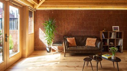london's haringey brick bungalow house interior showing living space with exposed brick