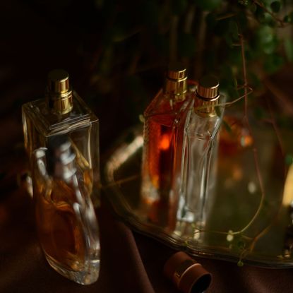 Perfume bottles on mirrored vanity