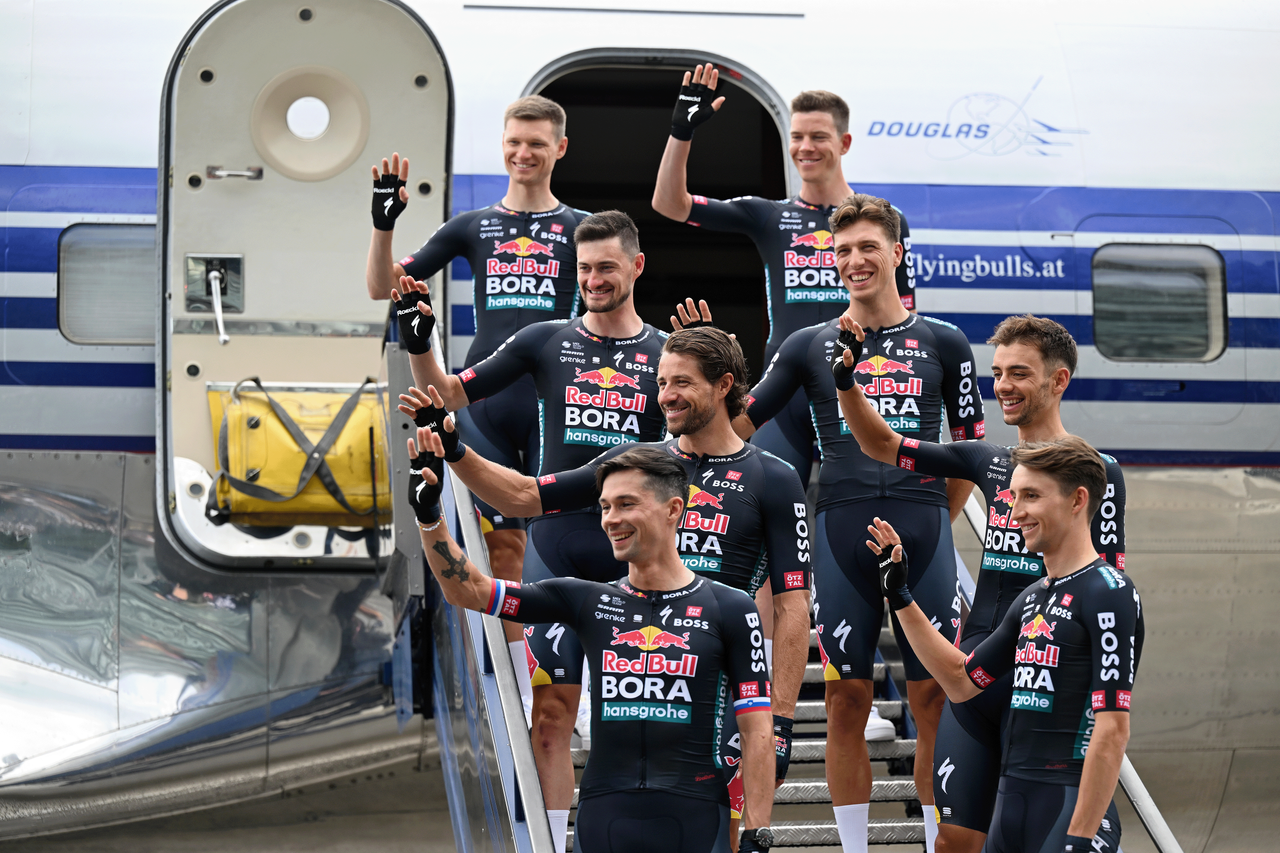 SALZBURG, AUSTRIA - JUNE 26: A general view of Primoz Roglic of Slovenia, Aleksandr Vlasov of Russia, Jai Hindley of Australia, Danny van Poppel of Netherlands, Matteo Sobrero of Italy, Marco Haller of Austria, Nico Denz of Germany and Team Red Bull - BORA - hansgrohe pose for a photograph in the Douglas DC-6B aircraft during the Official launch Team Red Bull - BORA - hansgrohe in Red Bull Hangar-7 on June 26, 2024 in Salzburg, Austria. (Photo by Tim de Waele/Getty Images)