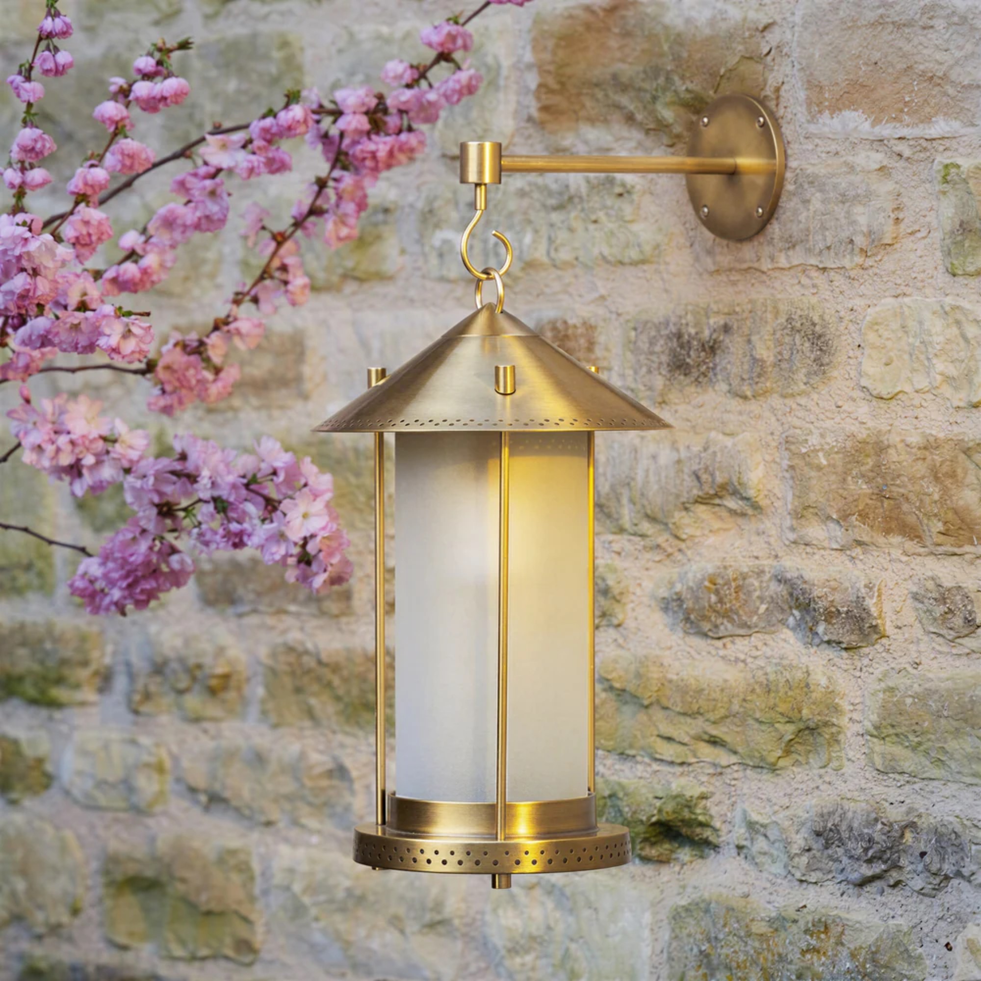 Pooky x The Novogratz Stefan rechargeable lantern in brass with a matching wall hook