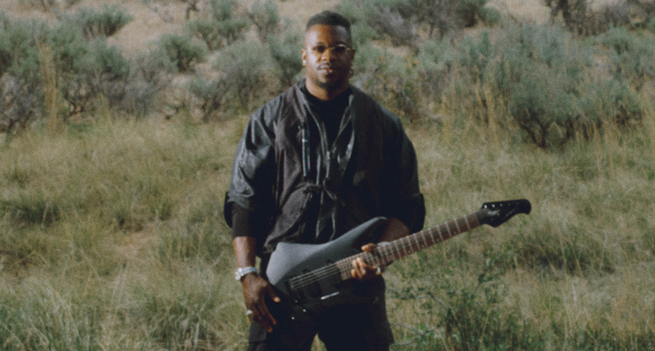 The Sterling By Music Man Kaizen is a more affordable version of the Animals As Leaders guitarist Tosin Abasi&#039;s signature model, and is offered here in Firemist Purple Satin and Stealth Black. 